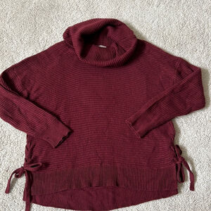 Women’s burgundy ribbed sweater with side ties. Size L